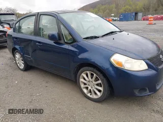 2011 Suzuki SX4 LE with VIN JS2YC5A23B6304713, listed as a IAAI auction lot 41997287 with 114,024 mi miles. Bid and sale history available at carsss.com. Image 1.