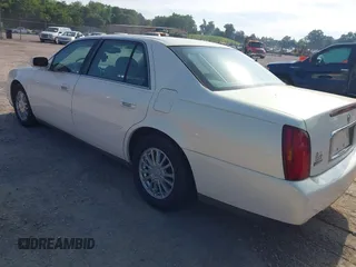 2004 Cadillac DeVille DHS z VIN 1G6KE57Y24U260694, wystawiony jako IAAI lot #42235533 z przebiegiem 156 689 mil mil oraz . Historia ofert i sprzedaży dostępna na DreamBid. Obrazek 3.