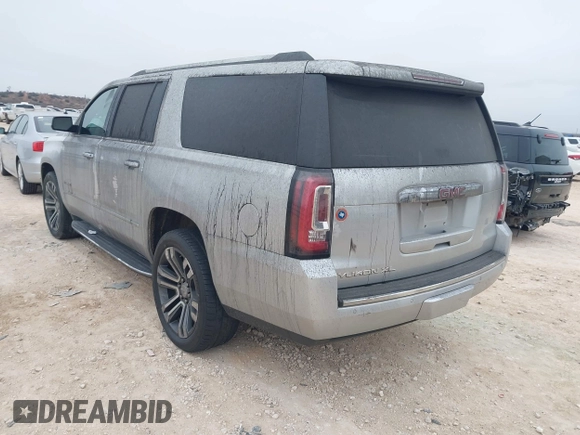2019 GMC Yukon XL Denali with VIN 1GKS1HKJ0KR257673, listed as a IAAI auction lot 41375951 with 71,291 mi miles. Bid and sale history available at carsss.com. Image 3.