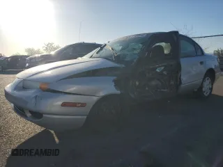 2000 Saturn SL z VIN 1G8ZH5281YZ242734, wystawiony jako Copart lot #57433915 z przebiegiem Nie podano mil oraz Szkoda całkowita • Salvage title. Historia ofert i sprzedaży dostępna na DreamBid. Obrazek 1.