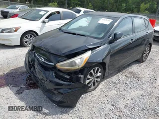 2015 Hyundai Accent Sport with VIN KMHCU5AE5FU233054, listed as a IAAI auction lot 41932298 with 70,278 mi miles. Bid and sale history available at carsss.com. Image 2.