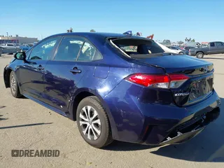 2021 Toyota Corolla Hybrid LE with VIN JTDEAMDEXMJ018828, listed as a IAAI auction lot 41633192 with 63,302 mi miles. Bid and sale history available at carsss.com. Image 3.