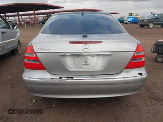 2004 Mercedes-Benz E-Class 5.0L with VIN WDBUF70J14A522118, listed as a IAAI auction lot 41786440 with 153,325 mi miles. Bid and sale history available at carsss.com. Image 6.