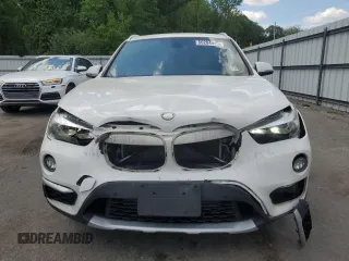 2018 BMW X1 xDrive28i with VIN WBXHT3C35J5F90062, listed as a Copart auction lot 56284945 with 138,137 mi miles and Salvage title. Bid and sale history available at DreamBid. Image 5.
