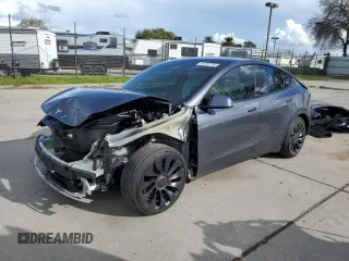 2022 Tesla Model Y Performance z VIN 7SAYGDEF8NF341273, wystawiony jako Copart lot #49292105 z przebiegiem 23 600 mil mil oraz Szkoda całkowita • Salvage title. Historia ofert i sprzedaży dostępna na DreamBid. Obrazek 1.