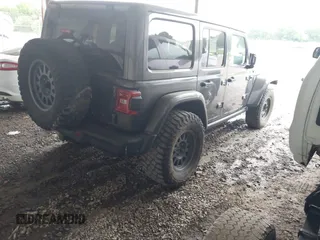 2021 Jeep Wrangler Unlimited Rubicon with VIN 1C4JJXFM6MW538774, listed as a IAAI auction lot 42368651 with 49,490 mi miles and . Bid and sale history available at DreamBid. Image 4.