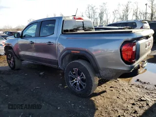 2023 GMC Canyon 4WD AT4 with VIN 1GTP6DEK5P1170230, listed as a Copart auction lot 42701935 with 26,704 mi miles and Salvage Title. Bid and sale history available at carsss.com. Image 2.