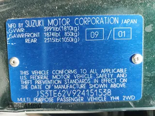2002 Suzuki Grand Vitara JS z VIN JS3TE62V924151538, wystawiony jako Copart lot #58900085 z przebiegiem 130 514 mil mil oraz Szkoda całkowita • Salvage title. Historia ofert i sprzedaży dostępna na DreamBid. Obrazek 13.