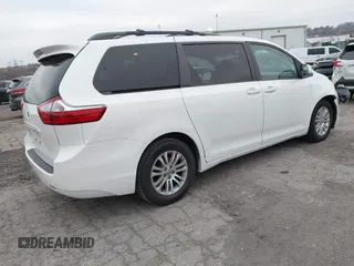 2015 Toyota Sienna XLE with VIN 5TDYK3DC9FS595827, listed as a IAAI auction lot 41014820 with 119,143 mi miles. Bid and sale history available at carsss.com. Image 4.