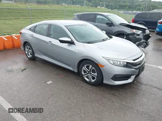 2017 Honda Civic LX with VIN 19XFC2F52HE068142, listed as a IAAI auction lot 42421017 with 64,041 mi miles and . Bid and sale history available at DreamBid. Image 1.