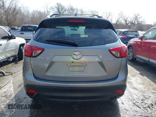 2014 Mazda CX-5 Grand Touring with VIN JM3KE2DY8E0375025, listed as a IAAI auction lot 41657755 with 103,601 mi miles. Bid and sale history available at carsss.com. Image 16.