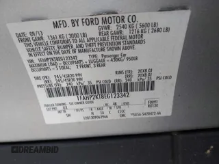 2014 Ford Taurus SHO with VIN 1FAHP2KT8EG123342, listed as a IAAI auction lot 42095390 with 142,957 mi miles. Bid and sale history available at carsss.com. Image 9.