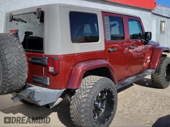 2010 Jeep Wrangler Unlimited Sahara with VIN 1J4BA5H10AL117474, listed as a IAAI auction lot 41969202 with 131,256 mi miles. Bid and sale history available at carsss.com. Image 4.