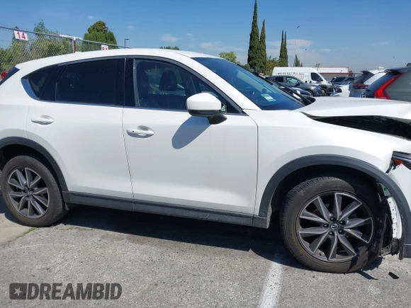2018 Mazda CX-5 Grand Touring with VIN JM3KFADM8J0373368, listed as a IAAI auction lot 42013535 with 63,142 mi miles and . Bid and sale history available at DreamBid. Image 13.