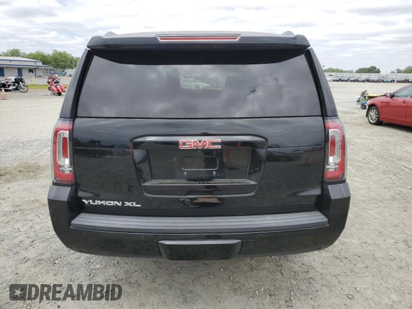 2016 GMC Yukon XL SLT with VIN 1GKS2GKC9GR251418, listed as a Copart auction lot 53750035 with 109,035 mi miles and Salvage Title. Bid and sale history available at DreamBid. Image 6.
