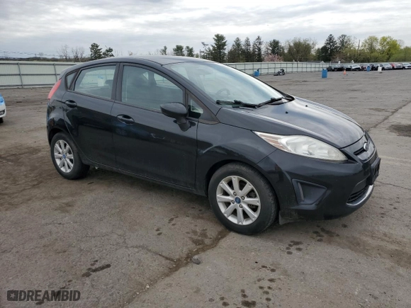 2012 Ford Fiesta SE with VIN 3FADP4EJ9CM155739, listed as a Copart auction lot 53532995 with 99,224 mi miles and Salvage Title. Bid and sale history available at carsss.com. Image 4.
