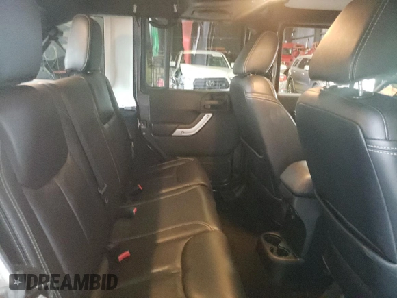 2014 Jeep Wrangler Unlimited Rubicon with VIN 1C4HJWFG7EL302897, listed as a Copart auction lot 48969425 with 57,976 mi miles and Salvage title. Bid and sale history available at DreamBid. Image 10.