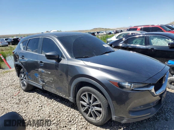 2018 Mazda CX-5 Touring z VIN JM3KFACM5J0338126, wystawiony jako Copart lot #56185795 z przebiegiem 115 254 mil mil oraz Szkoda całkowita • Salvage title. Historia ofert i sprzedaży dostępna na DreamBid. Obrazek 4.