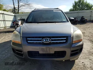 2007 Kia Sportage LX z VIN KNDJE723X77430674, wystawiony jako Copart lot #57050615 z przebiegiem 136 731 mil mil oraz Szkoda całkowita • Salvage title. Historia ofert i sprzedaży dostępna na DreamBid. Obrazek 5.