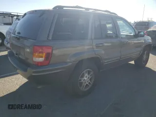 1999 Jeep Grand Cherokee Limited with VIN 1J4G268SXXC759016, listed as a Copart auction lot 80307534 with 215,870 mi miles and Salvage title. Bid and sale history available at DreamBid. Image 3.