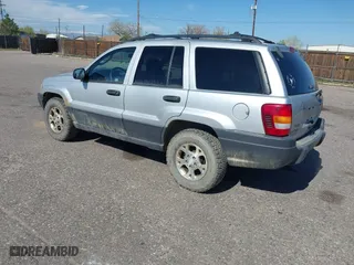 2003 Jeep Grand Cherokee Laredo with VIN 1J4GW48S03C567770, listed as a IAAI auction lot 42028727 with 245,728 mi miles. Bid and sale history available at carsss.com. Image 3.