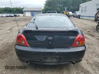 2003 Hyundai Tiburon GT z VIN KMHHN65F83U101784, wystawiony jako Copart lot #41566805 z przebiegiem 99 970 mil mil oraz Nie do naprawy • Non repairable. Historia ofert i sprzedaży dostępna na DreamBid. Obrazek 6.