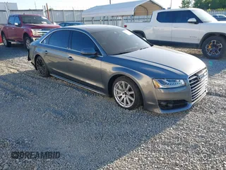 2017 Audi A8 z VIN WAU44AFD9HN010351, wystawiony jako IAAI lot #42039293 z przebiegiem 93 050 mil mil oraz . Historia ofert i sprzedaży dostępna na DreamBid. Obrazek 1.