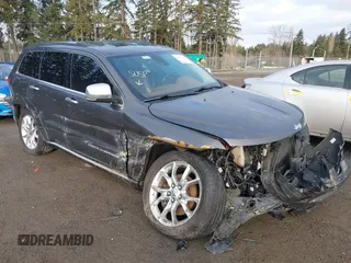 2015 Jeep Grand Cherokee Summit with VIN 1C4RJFJTXFC911170, listed as a IAAI auction lot 41523164 with 74,133 mi miles. Bid and sale history available at carsss.com. Image 1.