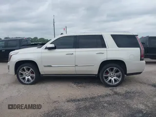 2015 Cadillac Escalade Premium z VIN 1GYS4CKJ4FR216873, wystawiony jako IAAI lot #41677234 z przebiegiem 128 990 mil mil oraz . Historia ofert i sprzedaży dostępna na DreamBid. Obrazek 14.