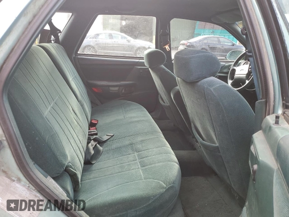 1994 Ford Taurus with VIN 1FALP5747RG236623, listed as a Copart auction lot 85242504 with 205,550 mi miles and Salvage title. Bid and sale history available at DreamBid. Image 10.