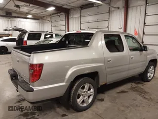 2009 Honda Ridgeline RTL with VIN 2HJYK16519H000129, listed as a IAAI auction lot 41891810 with 186,124 mi miles. Bid and sale history available at carsss.com. Image 4.