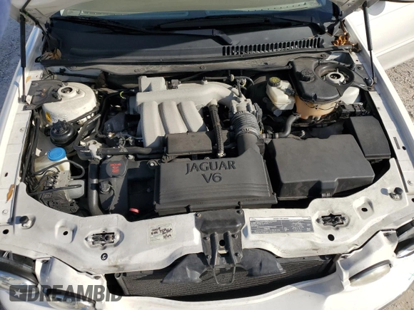 2007 Jaguar X-Type z VIN SAJWA51A67WJ24665, wystawiony jako Copart lot #86817544 z przebiegiem 52 027 mil mil oraz Szkoda całkowita • Salvage title. Historia ofert i sprzedaży dostępna na DreamBid. Obrazek 11.