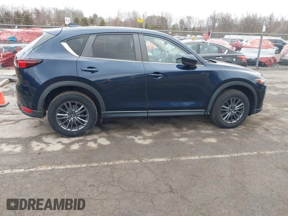 2021 Mazda CX-5 Touring with VIN JM3KFBCM7M1380396, listed as a IAAI auction lot 41707612 with 55,555 mi miles. Bid and sale history available at carsss.com. Image 13.