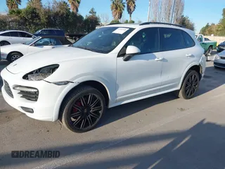 2013 Porsche Cayenne GTS with VIN WP1AD2A22DLA71143, listed as a IAAI auction lot 41287138 with 143,434 mi miles and . Bid and sale history available at DreamBid. Image 2.