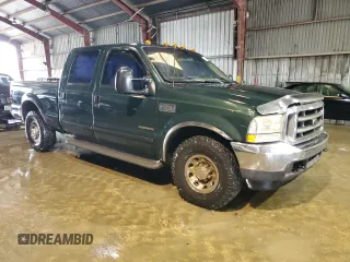 2002 Ford F-250 XL with VIN 1FTNW20F52EA52699, listed as a Copart auction lot 84088814 with 299,869 mi miles and Salvage Title. Bid and sale history available at DreamBid. Image 4.