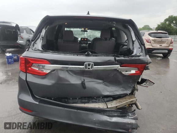 2018 Honda Odyssey EX with VIN 5FNRL6H50JB047999, listed as a Copart auction lot 57819495 with 121,295 mi miles and Salvage title. Bid and sale history available at DreamBid. Image 6.