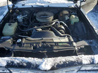 1984 Chevrolet Monte Carlo z VIN 1G1AZ37H3EB102999, wystawiony jako Copart lot #87061824 z przebiegiem 271 202 mil mil oraz Szkody całkowita. Historia ofert i sprzedaży dostępna na DreamBid. Obrazek 11.