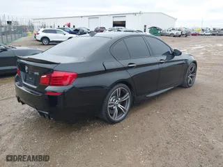 2013 BMW M5 with VIN WBSFV9C51DD095750, listed as a IAAI auction lot 40907304 with 93,014 mi miles. Bid and sale history available at carsss.com. Image 4.