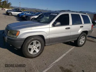 2003 Jeep Grand Cherokee Laredo with VIN 1J4GX48S63C523513, listed as a Copart auction lot 50001005 with 0 mi miles and Salvage Title. Bid and sale history available at carsss.com. Image 1.