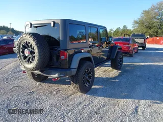 2015 Jeep Wrangler Unlimited Rubicon with VIN 1C4BJWFGXFL610153, listed as a IAAI auction lot 41575401 with 114,583 mi miles. Bid and sale history available at carsss.com. Image 4.