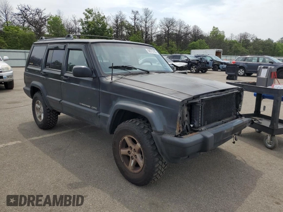 1999 Jeep Cherokee Sport with VIN 1J4FF68S9XL635836, listed as a Copart auction lot 59573195 with 187,035 mi miles and Salvage title. Bid and sale history available at DreamBid. Image 4.