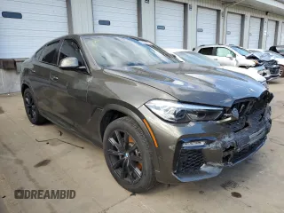 2020 BMW X6 xDrive40i z VIN 5UXCY6C07L9C74754, wystawiony jako Copart lot #62235632 z przebiegiem Nie podano mil oraz . Historia ofert i sprzedaży dostępna na DreamBid. Obrazek 1.