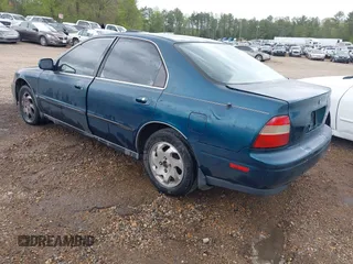 1994 Honda Accord LX with VIN 1HGCD5635RA157273, listed as a IAAI auction lot 41909466 with 196,202 mi miles. Bid and sale history available at carsss.com. Image 3.