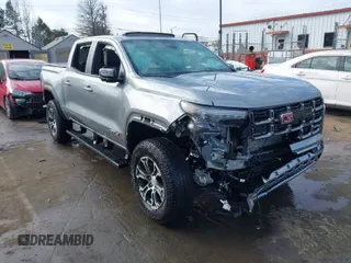 2024 GMC Canyon 4WD AT4 with VIN 1GTP6DEK3R1214437, listed as a IAAI auction lot 41195685 with 14,155 mi miles. Bid and sale history available at carsss.com. Image 1.