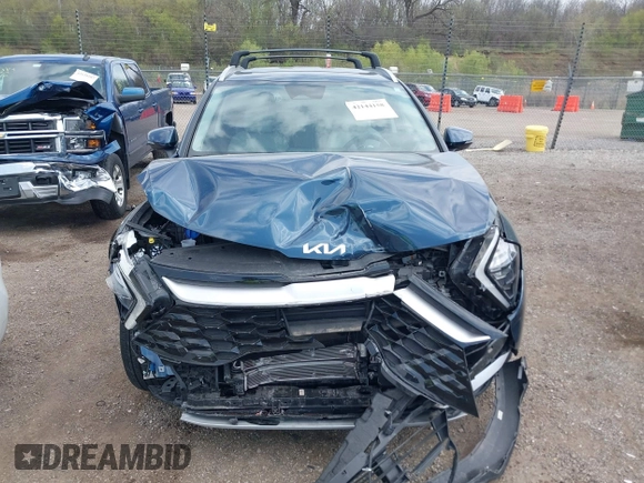 2023 Kia Sportage EX with VIN KNDPVCAGXP7104090, listed as a IAAI auction lot 42144158 with 26,983 mi miles and . Bid and sale history available at DreamBid. Image 13.