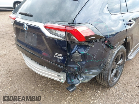 2021 Toyota RAV4 Hybrid XSE with VIN 4T3E6RFV0MU053245, listed as a IAAI auction lot 42426959 with 28,717 mi miles and . Bid and sale history available at DreamBid. Image 6.