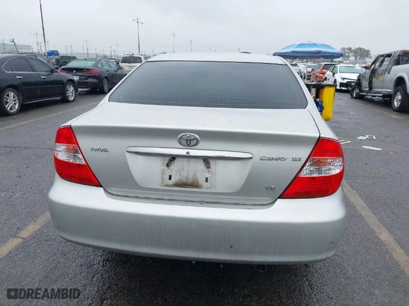 2004 Toyota Camry LE with VIN 4T1BF32K84U589638, listed as a IAAI auction lot 41571339 with 90,311 mi miles. Bid and sale history available at carsss.com. Image 16.