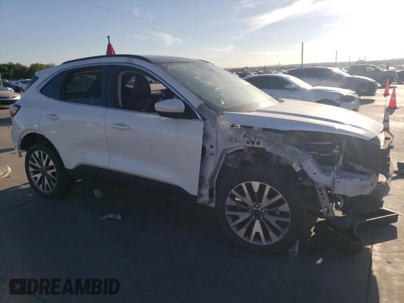 2022 Ford Escape Titanium z VIN 1FMCU9J91NUB93886, wystawiony jako Copart lot #69189524 z przebiegiem Nie podano mil oraz Czysty tytuł • Clean title. Historia ofert i sprzedaży dostępna na DreamBid. Obrazek 4.