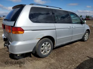 2002 Honda Odyssey EX z VIN 2HKRL186X2H006763, wystawiony jako Copart lot #57317075 z przebiegiem 282 090 mil mil oraz Szkoda całkowita • Salvage title. Historia ofert i sprzedaży dostępna na DreamBid. Obrazek 3.