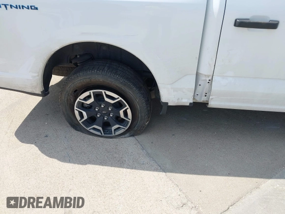 2023 Ford F-150 Lightning Pro with VIN 1FTVW1EL2PWG18764, listed as a IAAI auction lot 41908278 with 16,276 mi miles and . Bid and sale history available at DreamBid. Image 20.